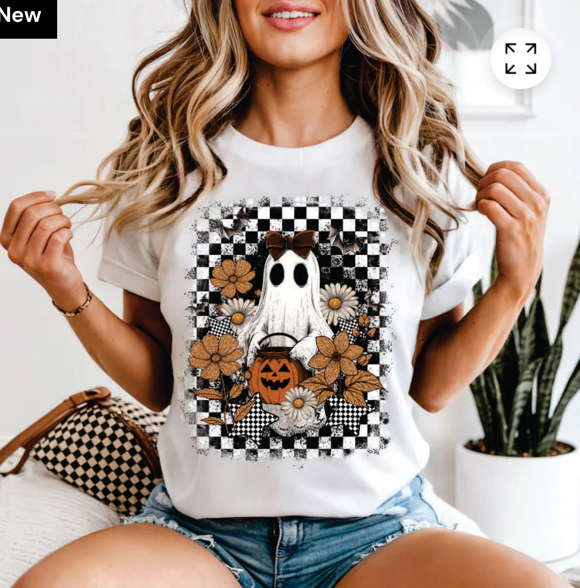 Checkered background with ghost and flowers